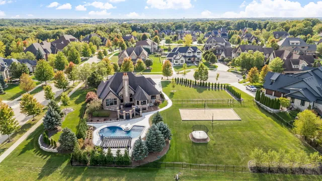 a view of a swimming pool with a yard