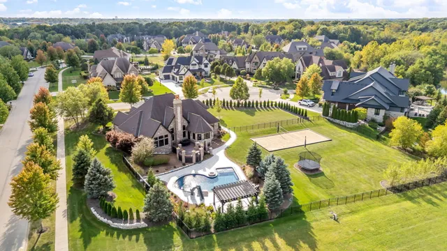 an aerial view of a house with a swimming pool