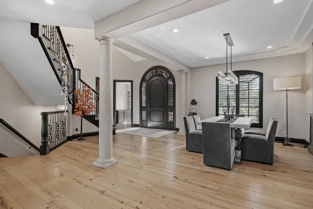a view of a livingroom with furniture window and wooden floor