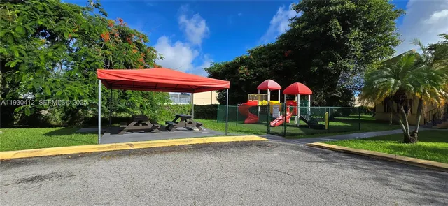 a sign that is sitting in front of a house