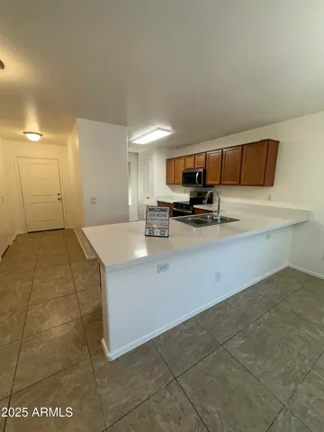 a kitchen with a sink and cabinets