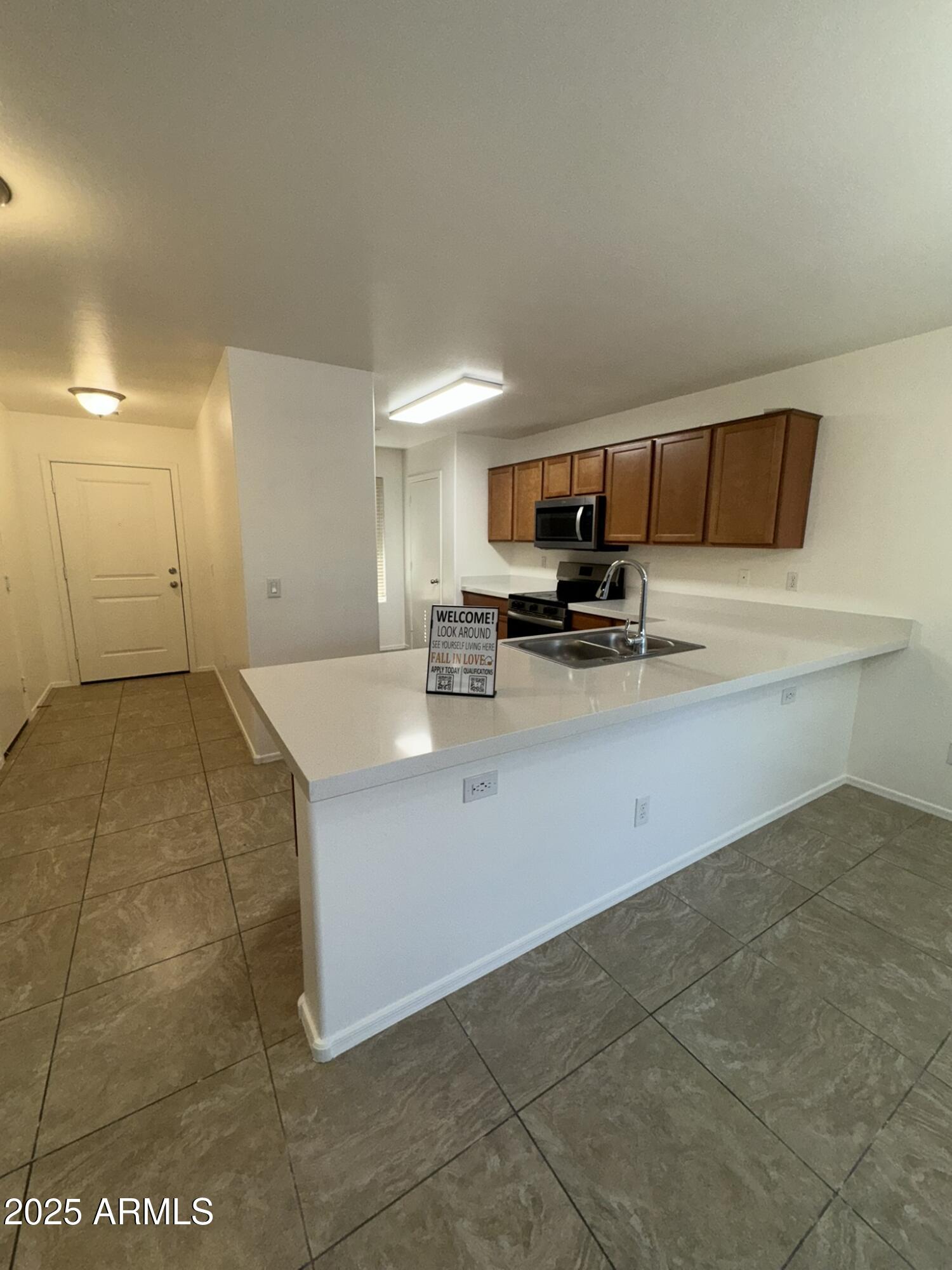 1976 West Rd Agent Street Apache Junction, AZ 85120 - Photo 2 of 15 a kitchen with a sink and cabinets