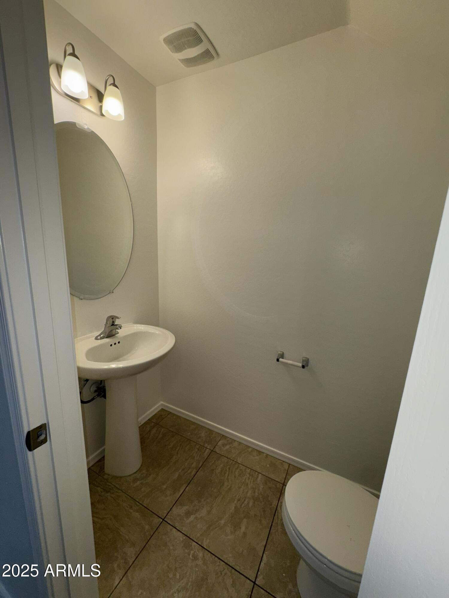 1976 West Rd Agent Street Apache Junction, AZ 85120 - Photo 3 of 15 a bathroom with a sink a toilet a mirror and vanity