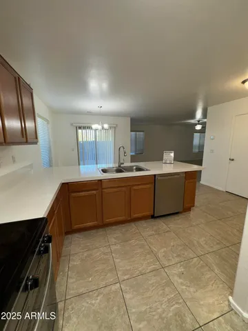 a kitchen with stainless steel appliances a sink and cabinets
