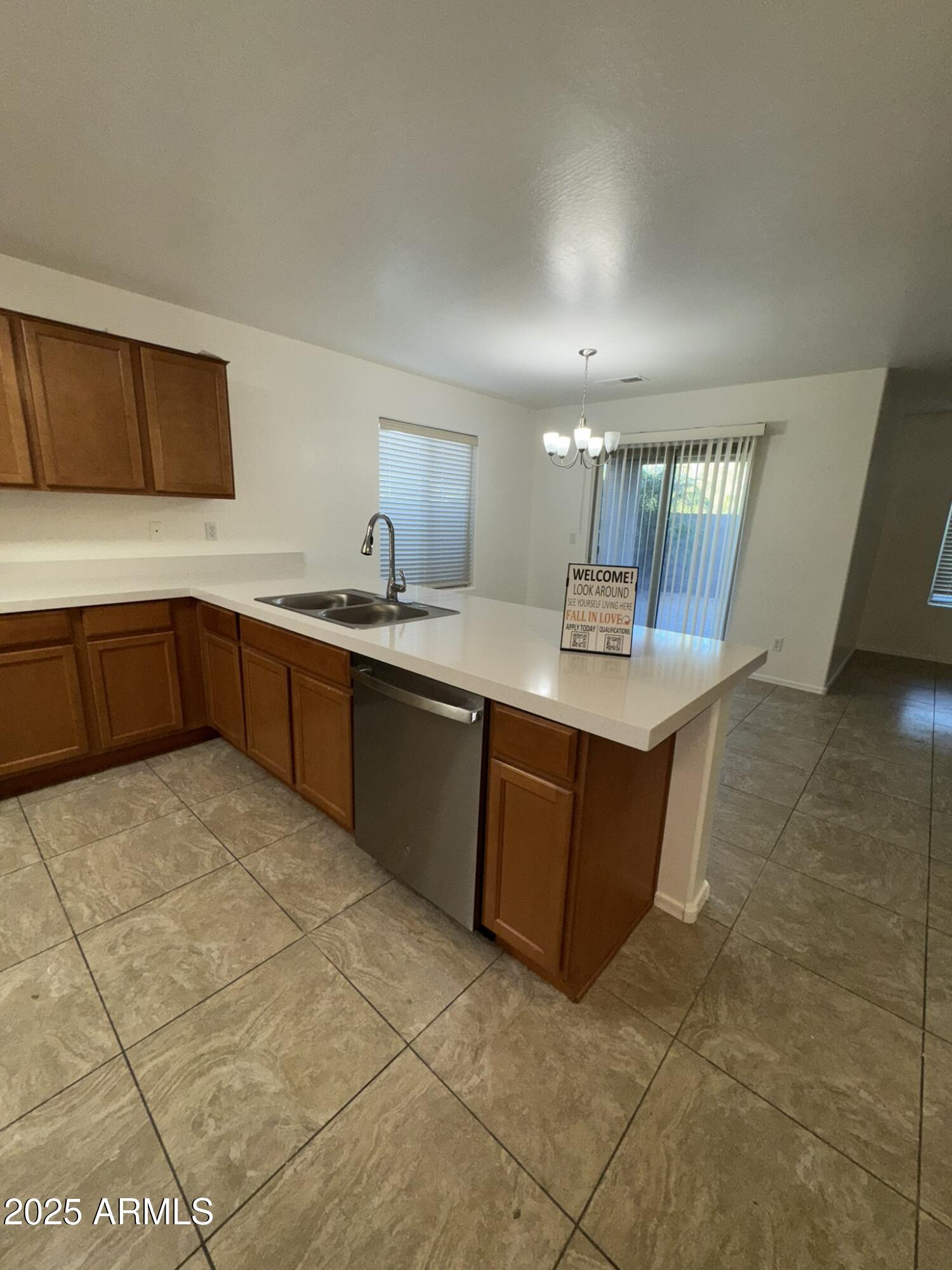 1976 West Rd Agent Street Apache Junction, AZ 85120 - Photo 5 of 15 a kitchen with a sink a counter top space and appliances