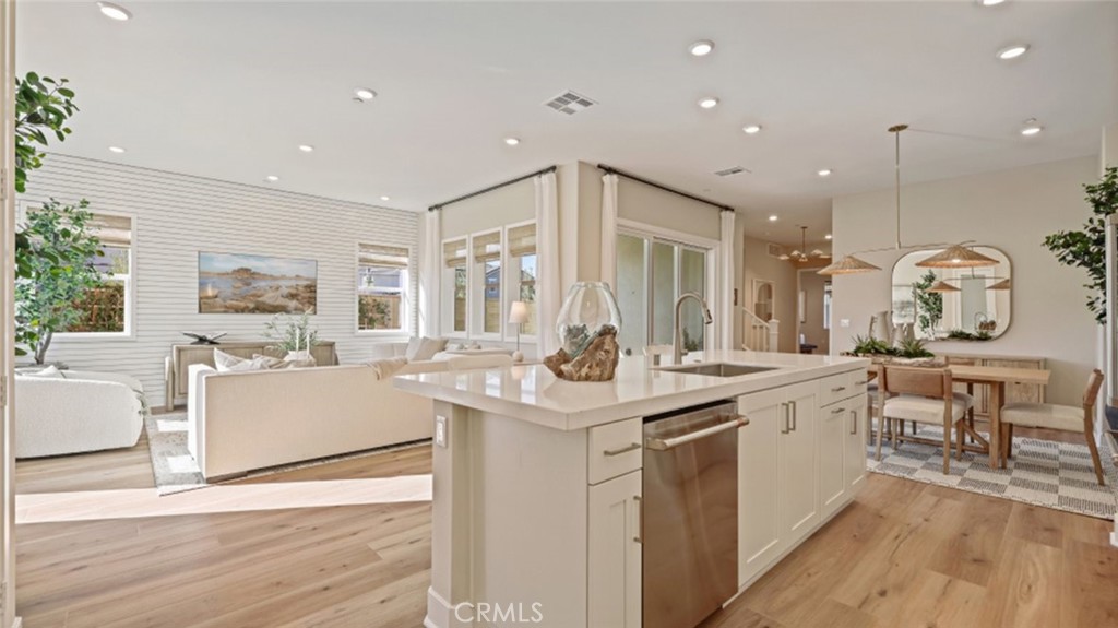 109 Trask Irvine, CA 92618 - Photo 3 of 34 a kitchen with a sink and wooden floor