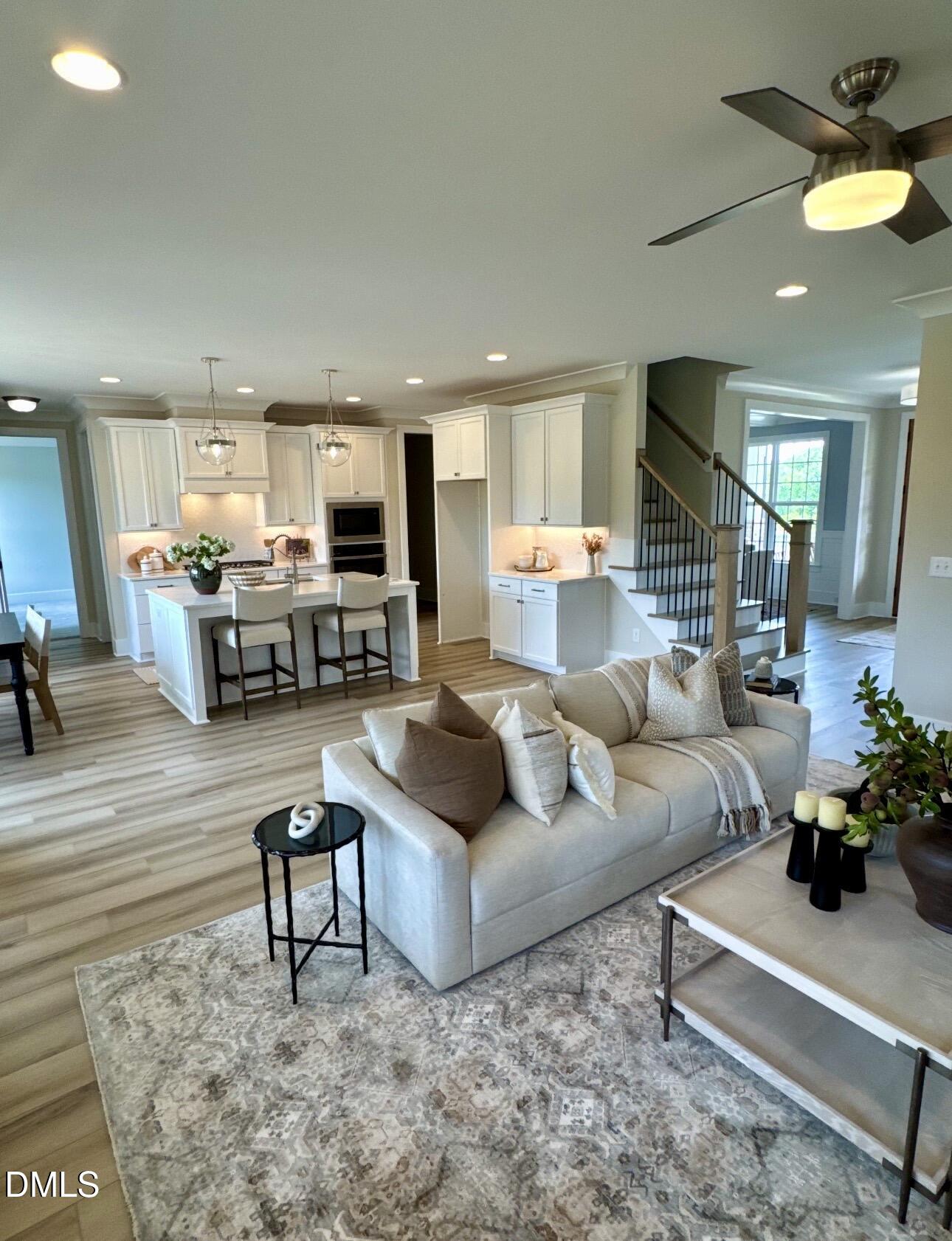 1057 Azalea Garden Circle Raleigh, NC 27603 - Photo 11 of 20 a living room with furniture and a chandelier