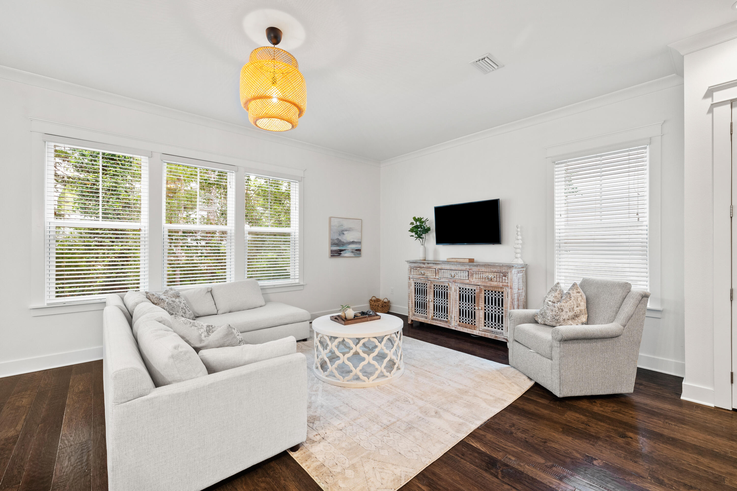 267 Emerald Beach Circle Santa Rosa Beach, FL 32459 - Photo 13 of 59 a living room with furniture a flat screen tv and a window