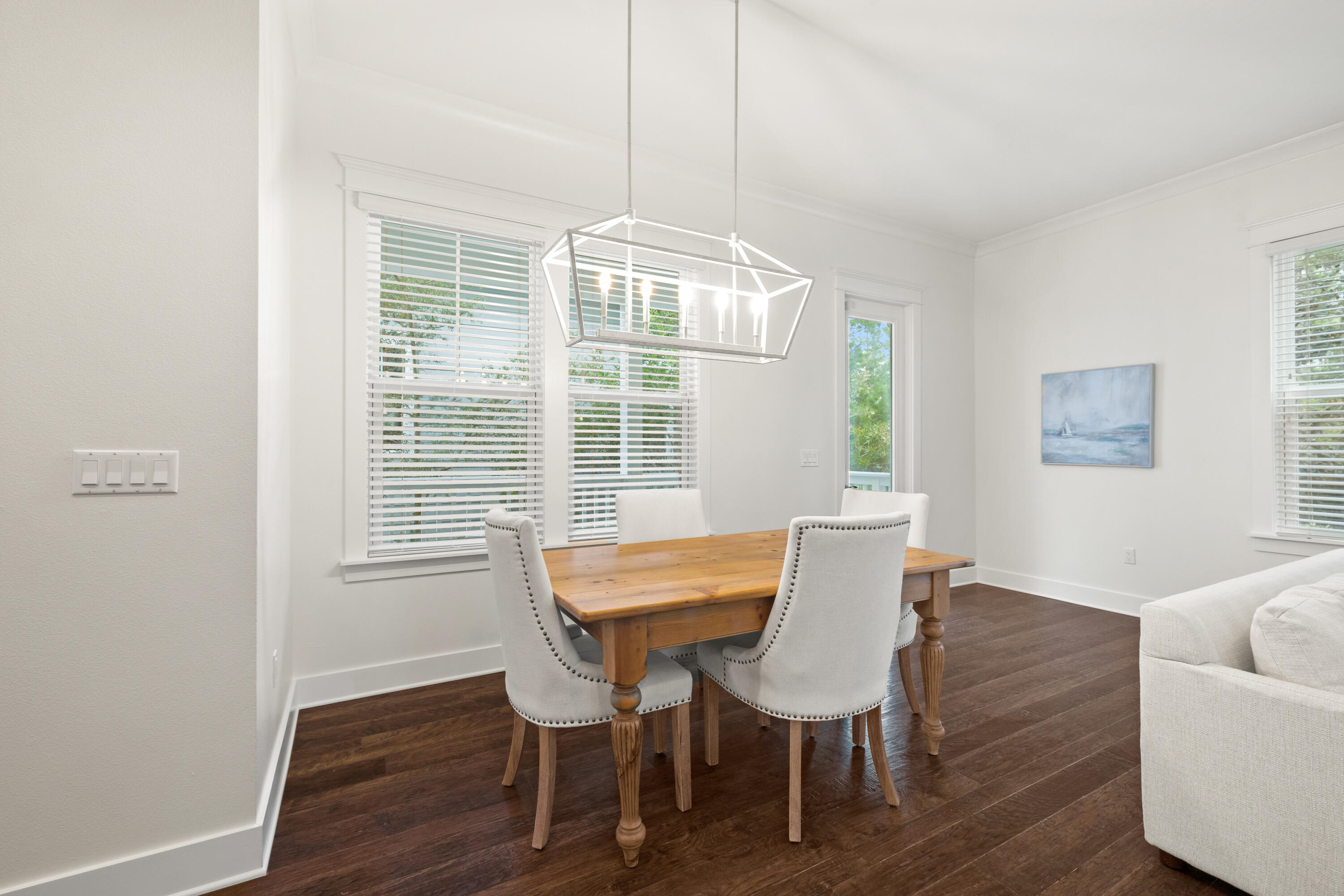 267 Emerald Beach Circle Santa Rosa Beach, FL 32459 - Photo 17 of 59 a view of a dining room with furniture and wooden floor