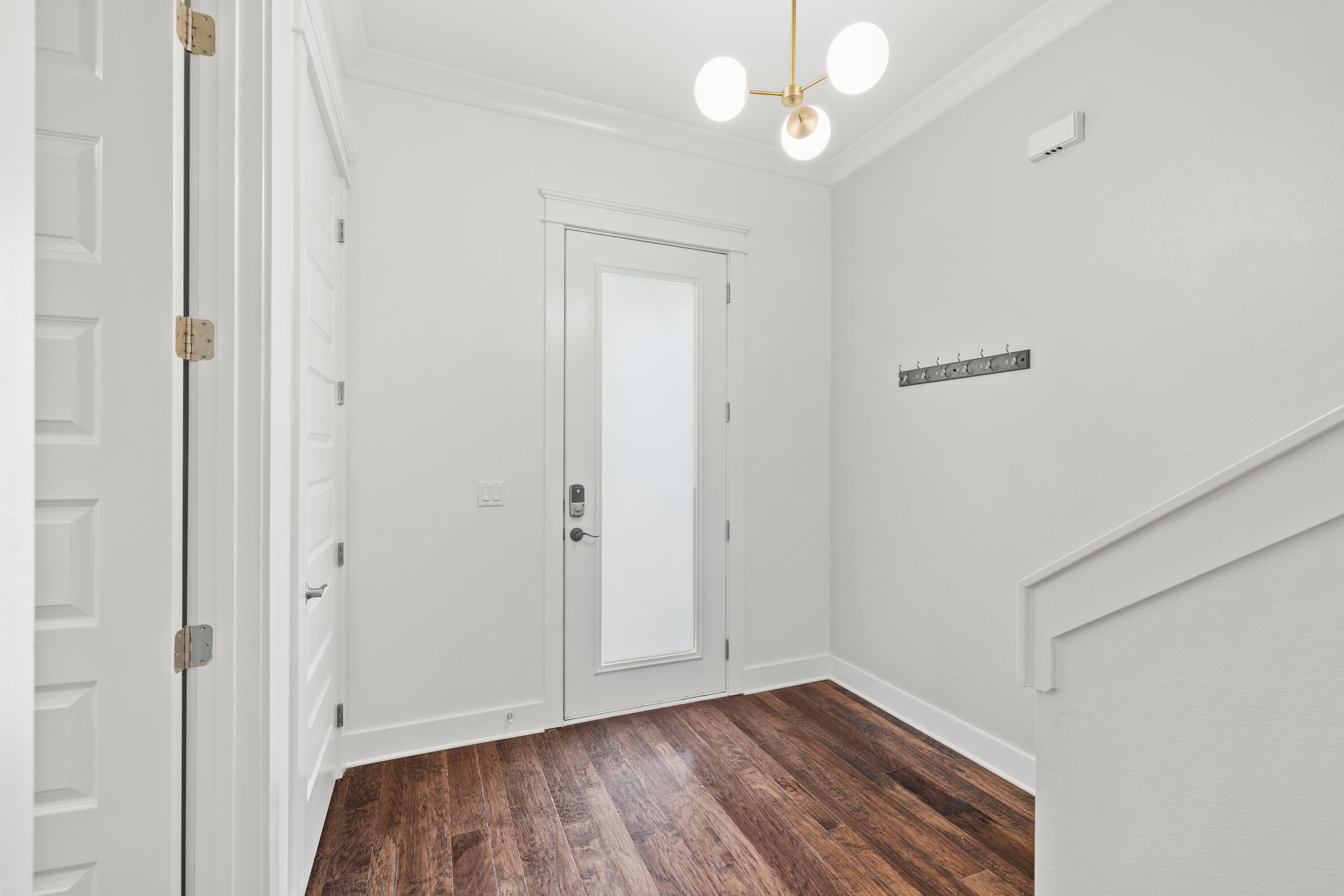 267 Emerald Beach Circle Santa Rosa Beach, FL 32459 - Photo 20 of 59 a view of an empty room with wooden floor