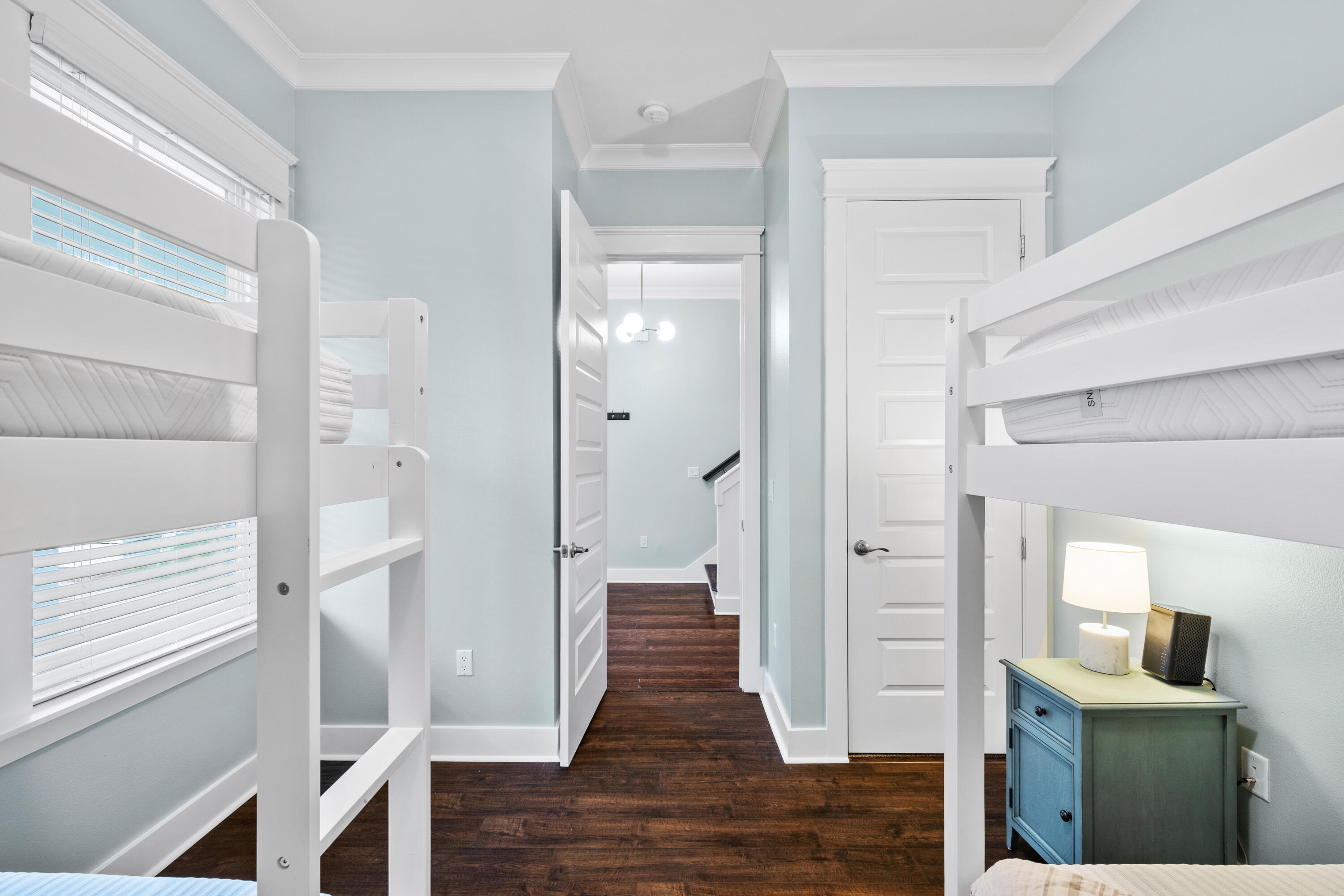 267 Emerald Beach Circle Santa Rosa Beach, FL 32459 - Photo 25 of 59 a view of a hallway with wooden floor and staircase