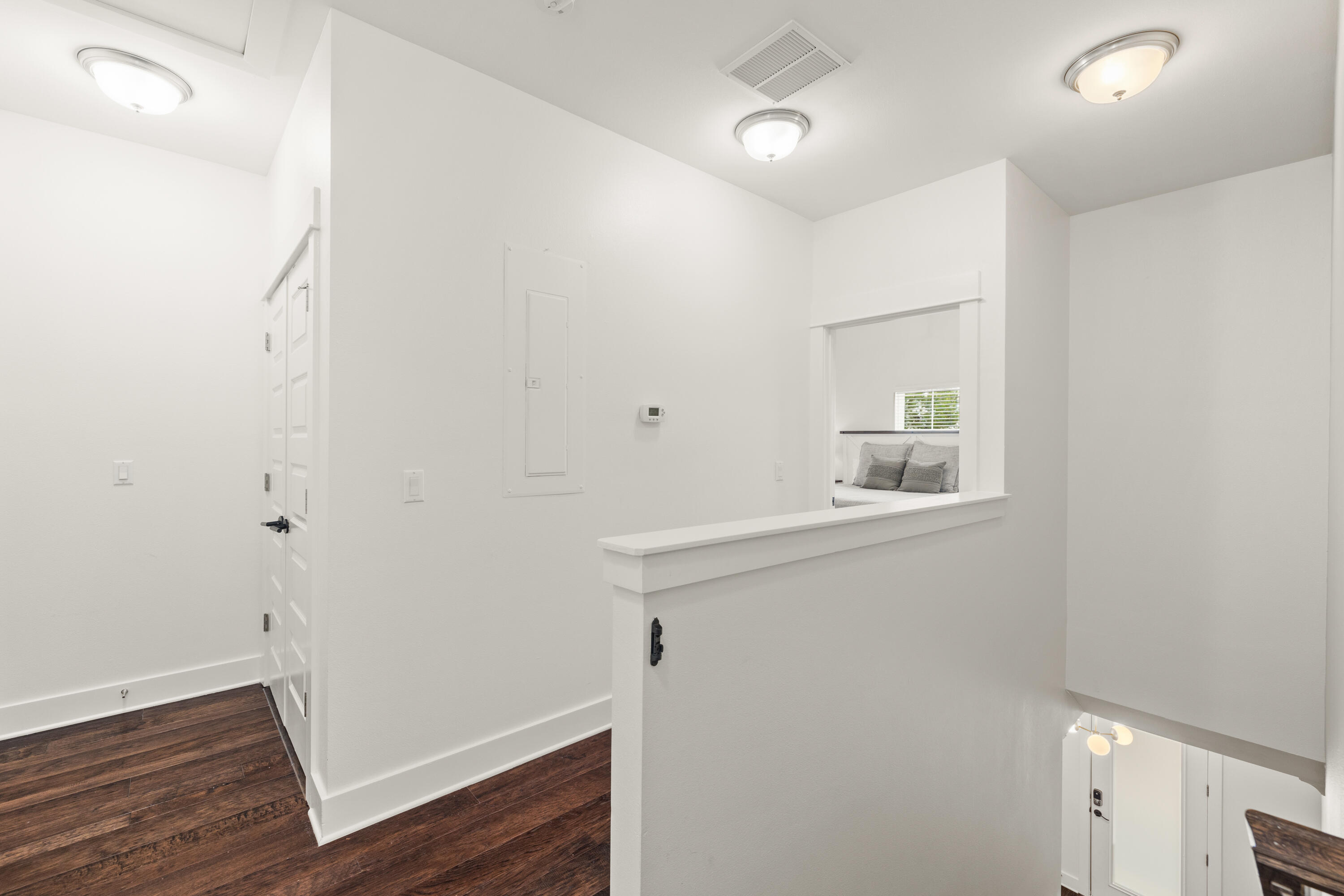 267 Emerald Beach Circle Santa Rosa Beach, FL 32459 - Photo 29 of 59 a view of a hallway with wooden floor