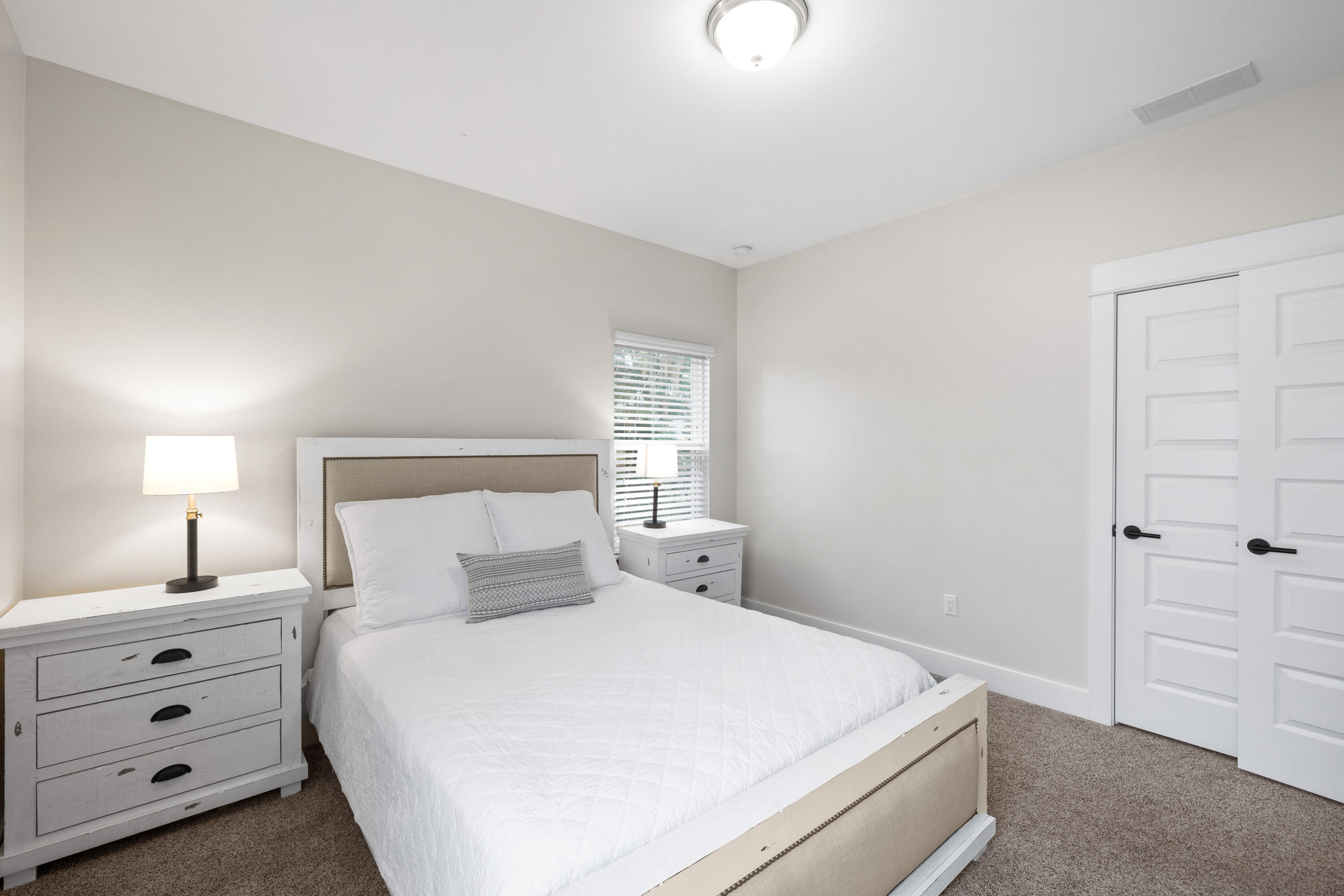 267 Emerald Beach Circle Santa Rosa Beach, FL 32459 - Photo 38 of 59 a bedroom with a bed and a night stand