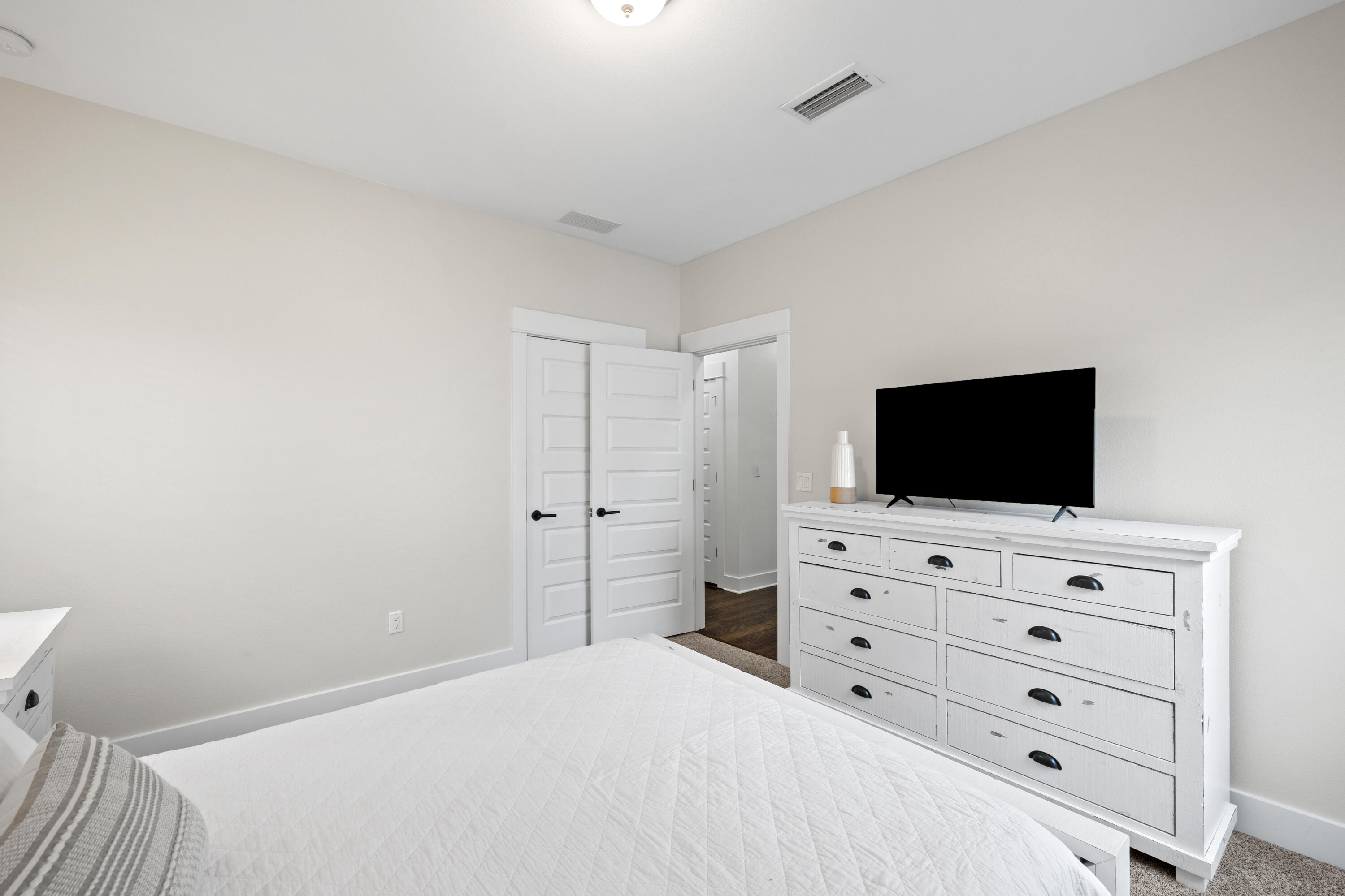 267 Emerald Beach Circle Santa Rosa Beach, FL 32459 - Photo 39 of 59 a bedroom with a bed and a flat screen tv