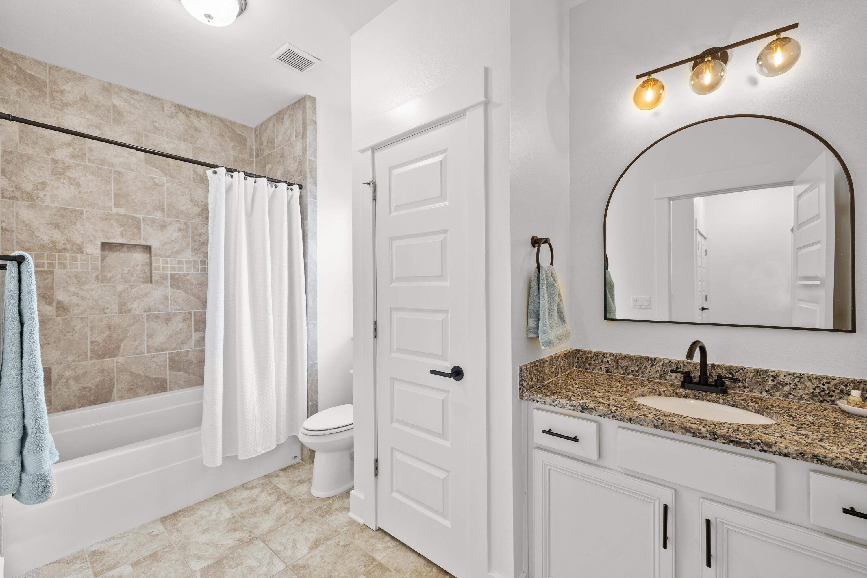 267 Emerald Beach Circle Santa Rosa Beach, FL 32459 - Photo 43 of 59 a bathroom with a granite countertop sink a toilet and a shower