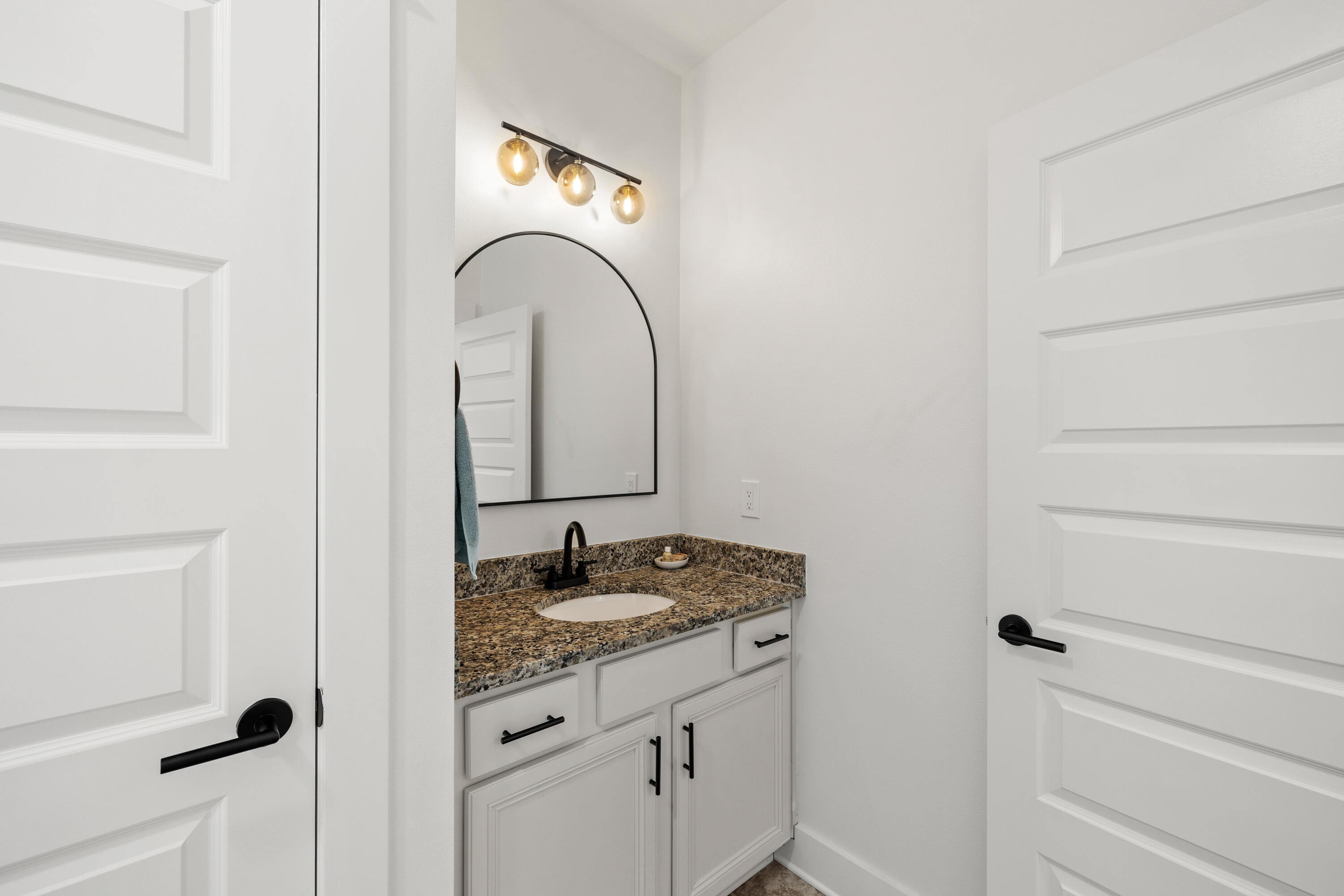 267 Emerald Beach Circle Santa Rosa Beach, FL 32459 - Photo 45 of 59 a bathroom with a granite countertop sink and a mirror