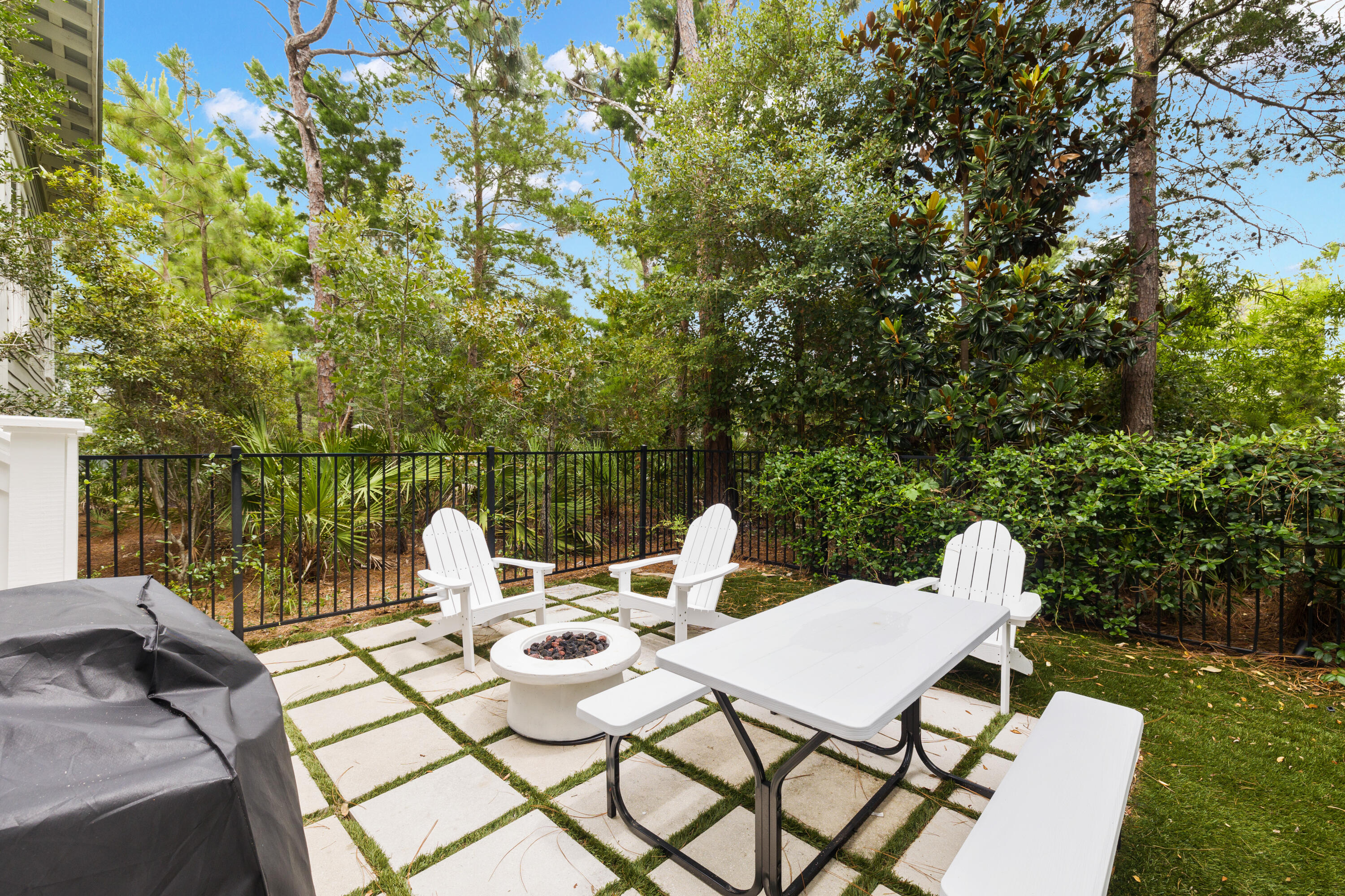 267 Emerald Beach Circle Santa Rosa Beach, FL 32459 - Photo 52 of 59 a view of a patio with a table and chairs