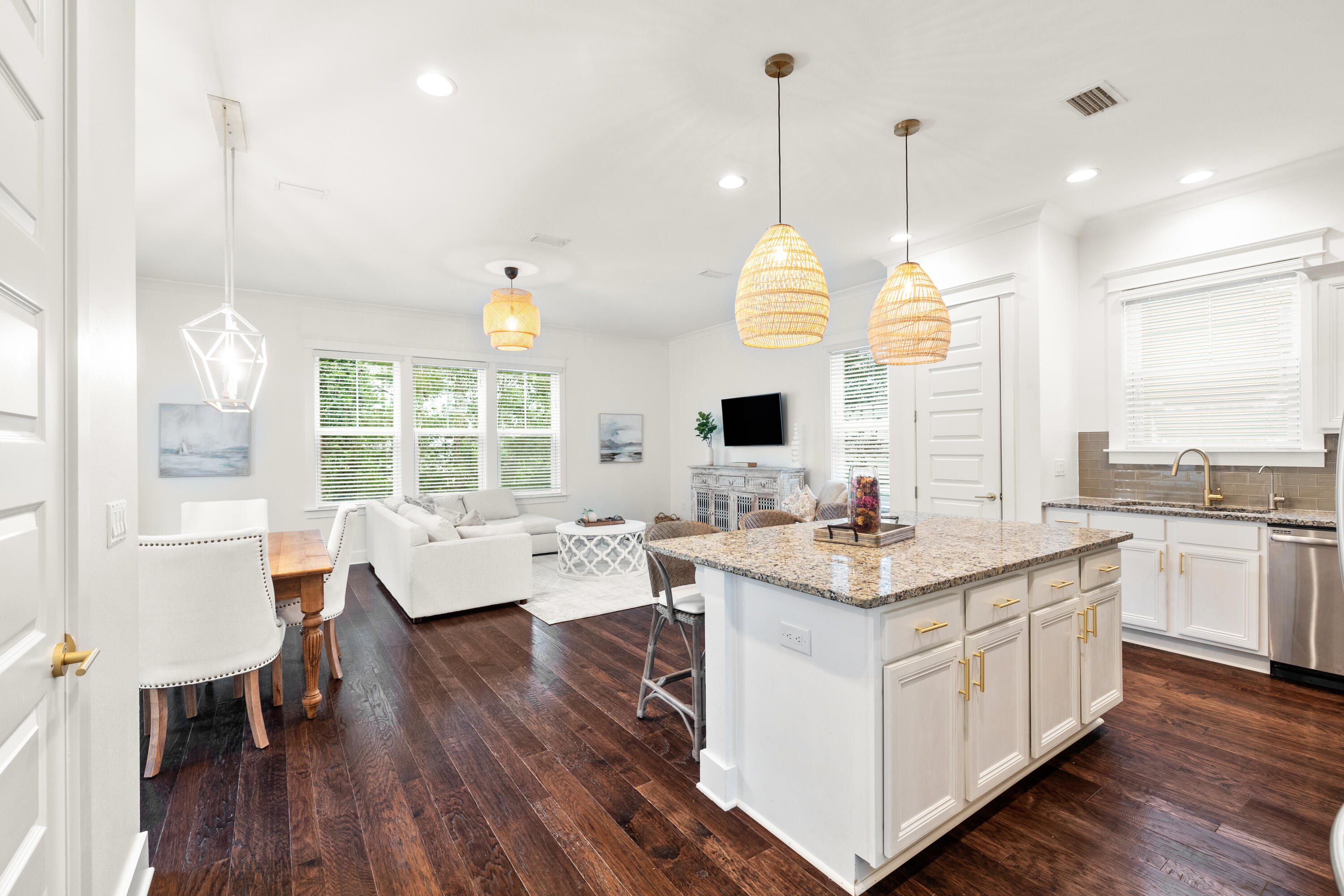 267 Emerald Beach Circle Santa Rosa Beach, FL 32459 - Photo 8 of 59 a open kitchen with stainless steel appliances granite countertop a stove and white cabinets with wooden floor