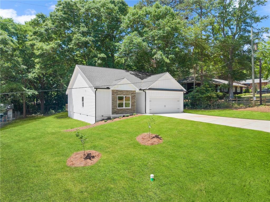 43 Anderson Street Jefferson, GA 30549 - Photo 3 of 45 a front view of a house with garden