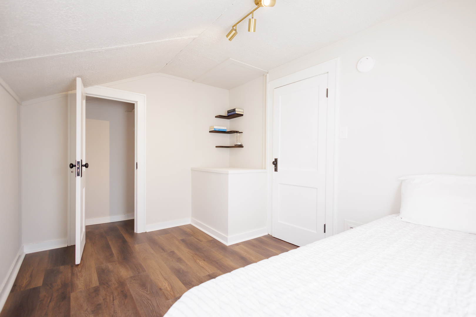 1240 West Merchant Street Kankakee, IL 60901 - Photo 20 of 25 a bedroom with a bed and a bathroom