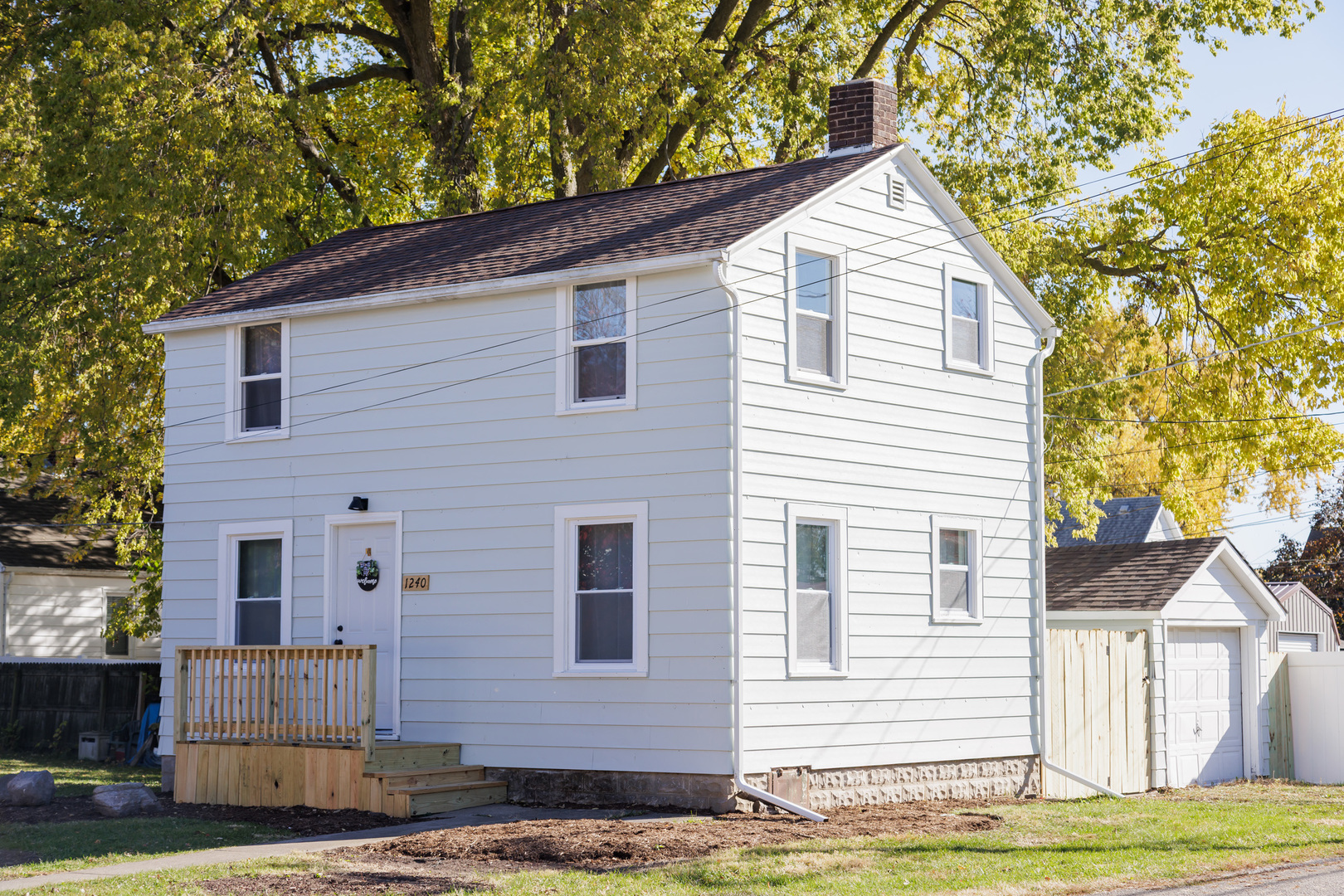 1240 West Merchant Street Kankakee, IL 60901 - Photo 3 of 25 a view of a house with a yard