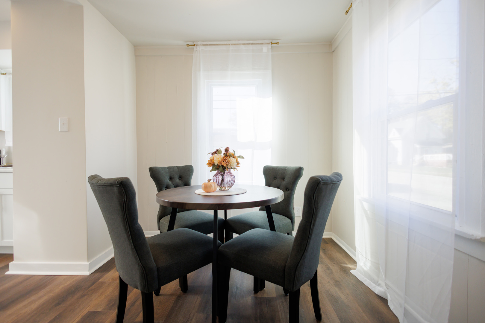 1240 West Merchant Street Kankakee, IL 60901 - Photo 7 of 25 a dining room with furniture and wooden floor