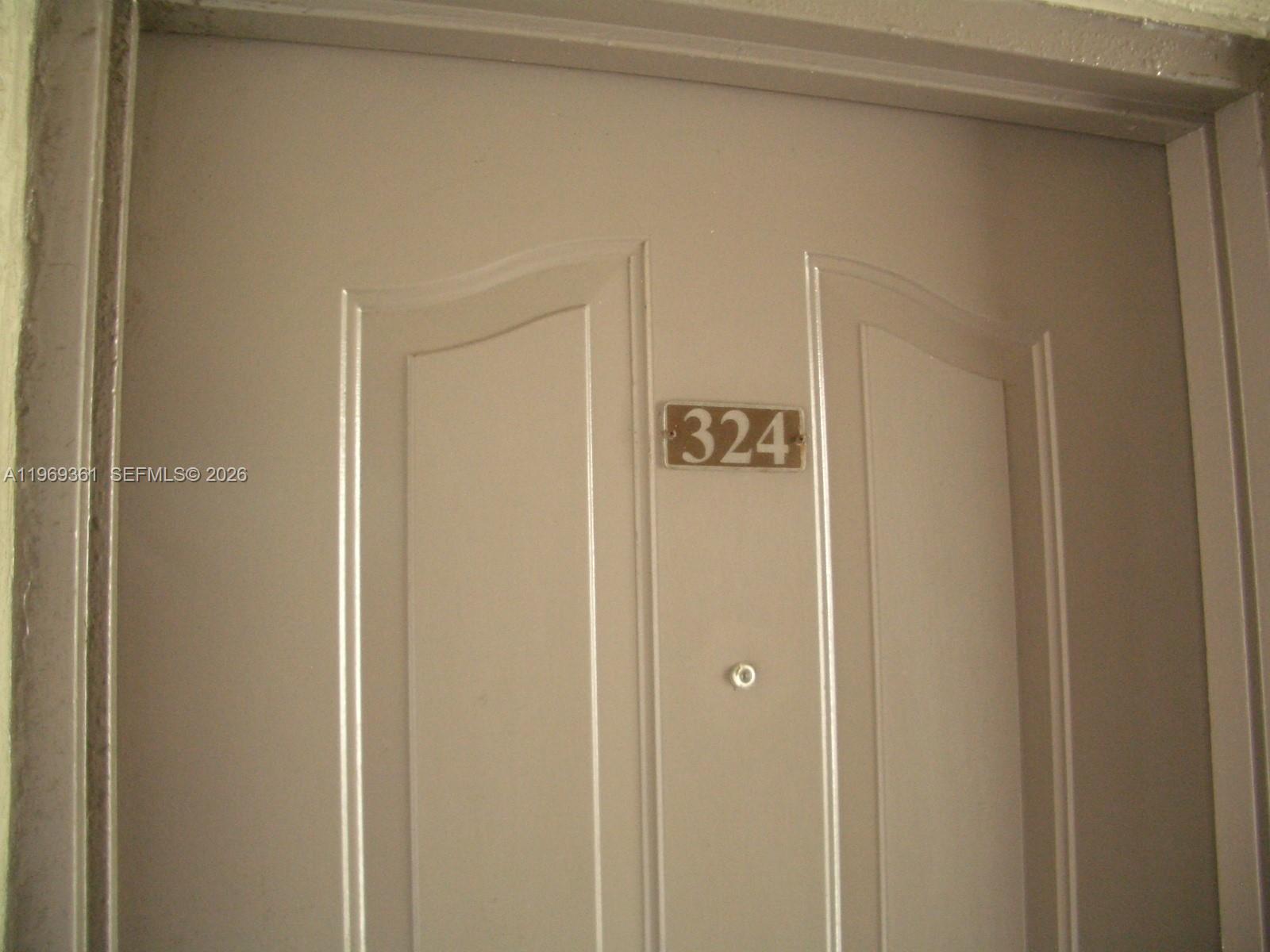 10900 Southwest 104th Street, Unit 324 Miami, FL 33176 - Photo 14 of 34 a view of room that has a door and a window
