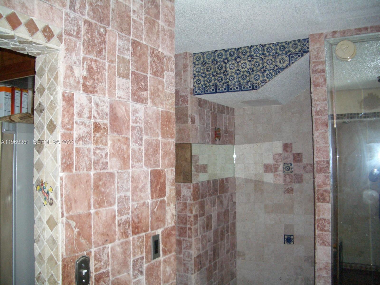 10900 Southwest 104th Street, Unit 324 Miami, FL 33176 - Photo 19 of 34 a bathroom with a shower