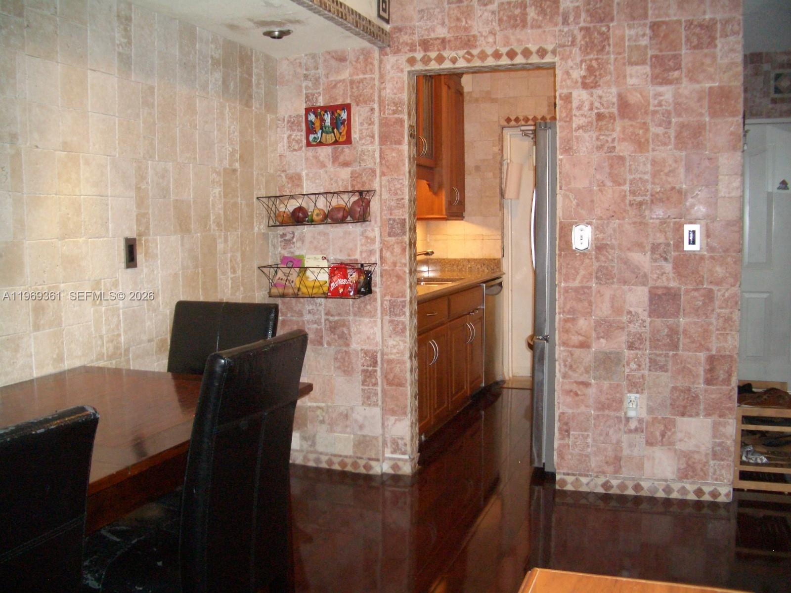 10900 Southwest 104th Street, Unit 324 Miami, FL 33176 - Photo 2 of 34 a balcony with table and chairs