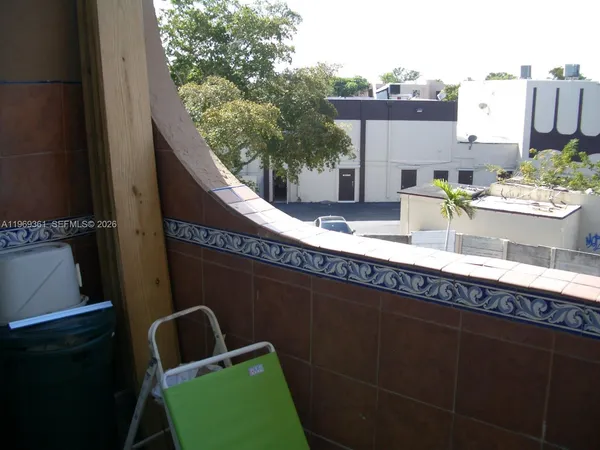 a view of a balcony with chairs