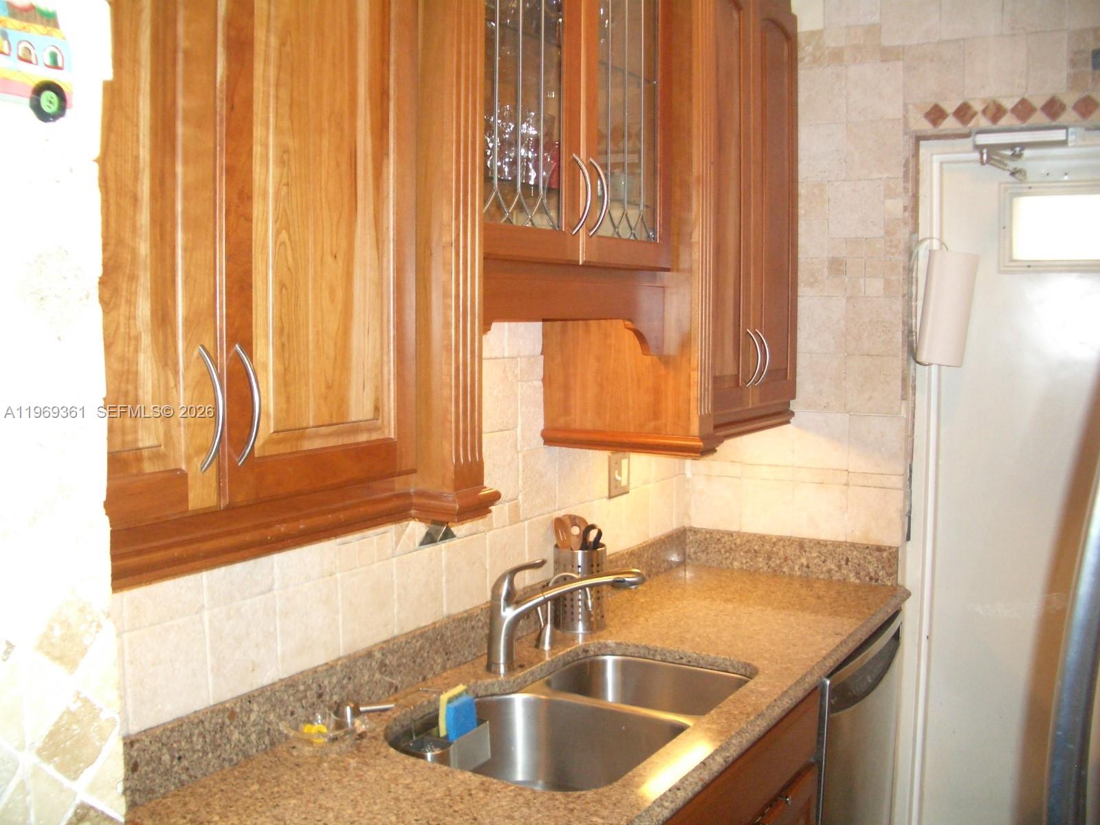 10900 Southwest 104th Street, Unit 324 Miami, FL 33176 - Photo 34 of 34 a bathroom with a sink and a mirror