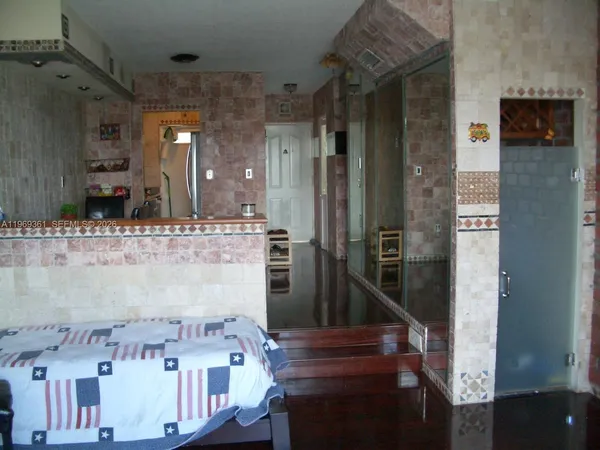 a bathroom with a bathtub and shower