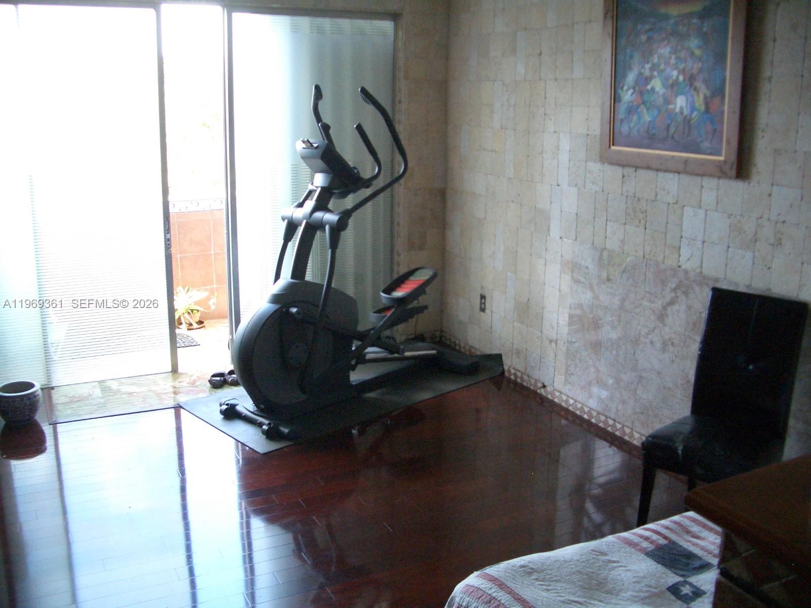 10900 Southwest 104th Street, Unit 324 Miami, FL 33176 - Photo 8 of 34 a living room with furniture and a flat screen tv