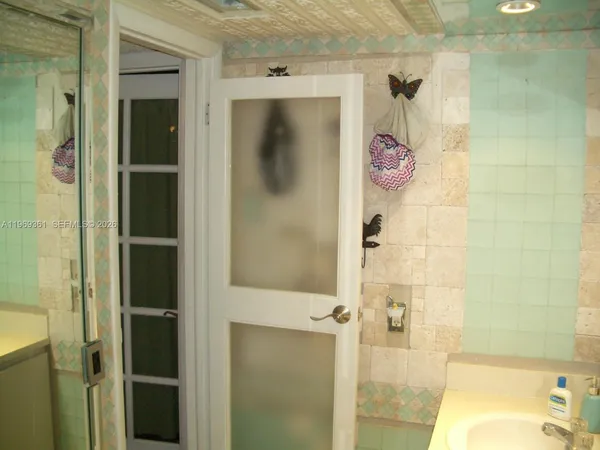 a bathroom with a sink and shower