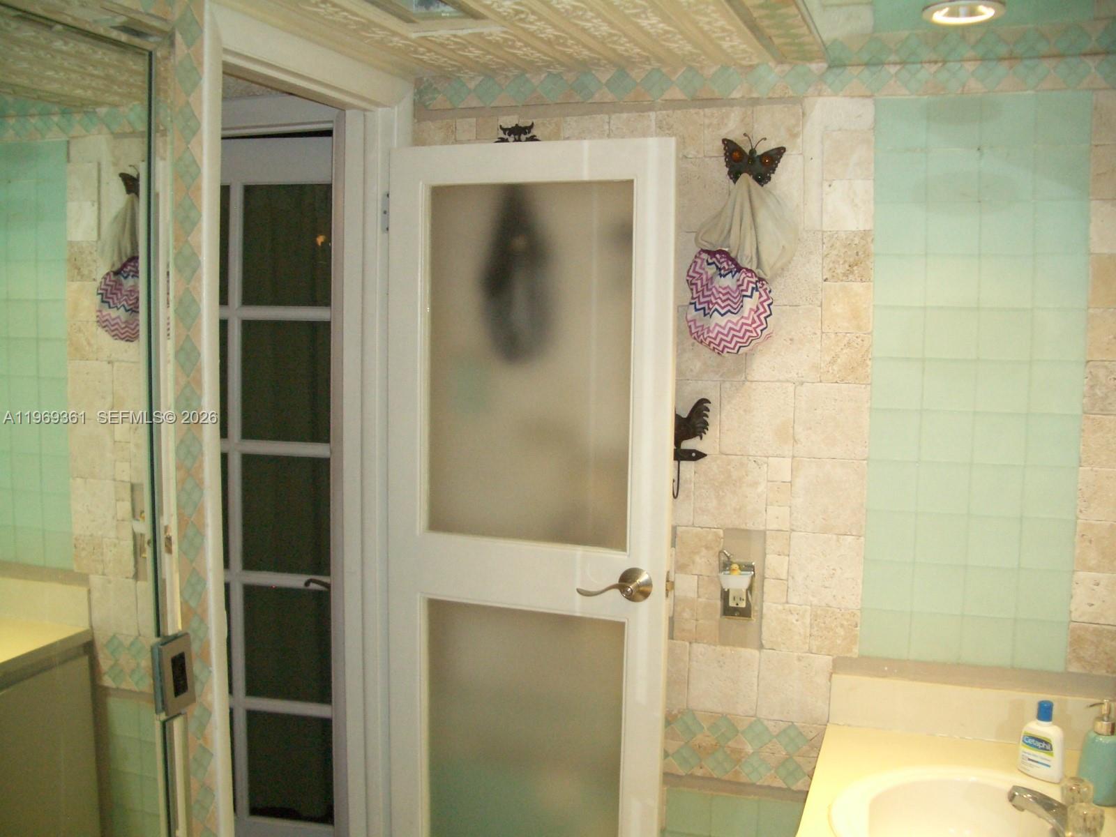 10900 Southwest 104th Street, Unit 324 Miami, FL 33176 - Photo 10 of 34 a bathroom with a sink and shower