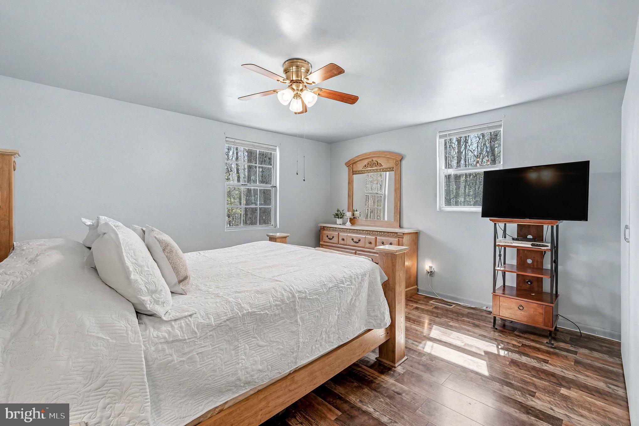 3440 Van Buren Road Burr Hill, VA 22433 - Photo 12 of 24 a bedroom with a bed and a flat screen tv