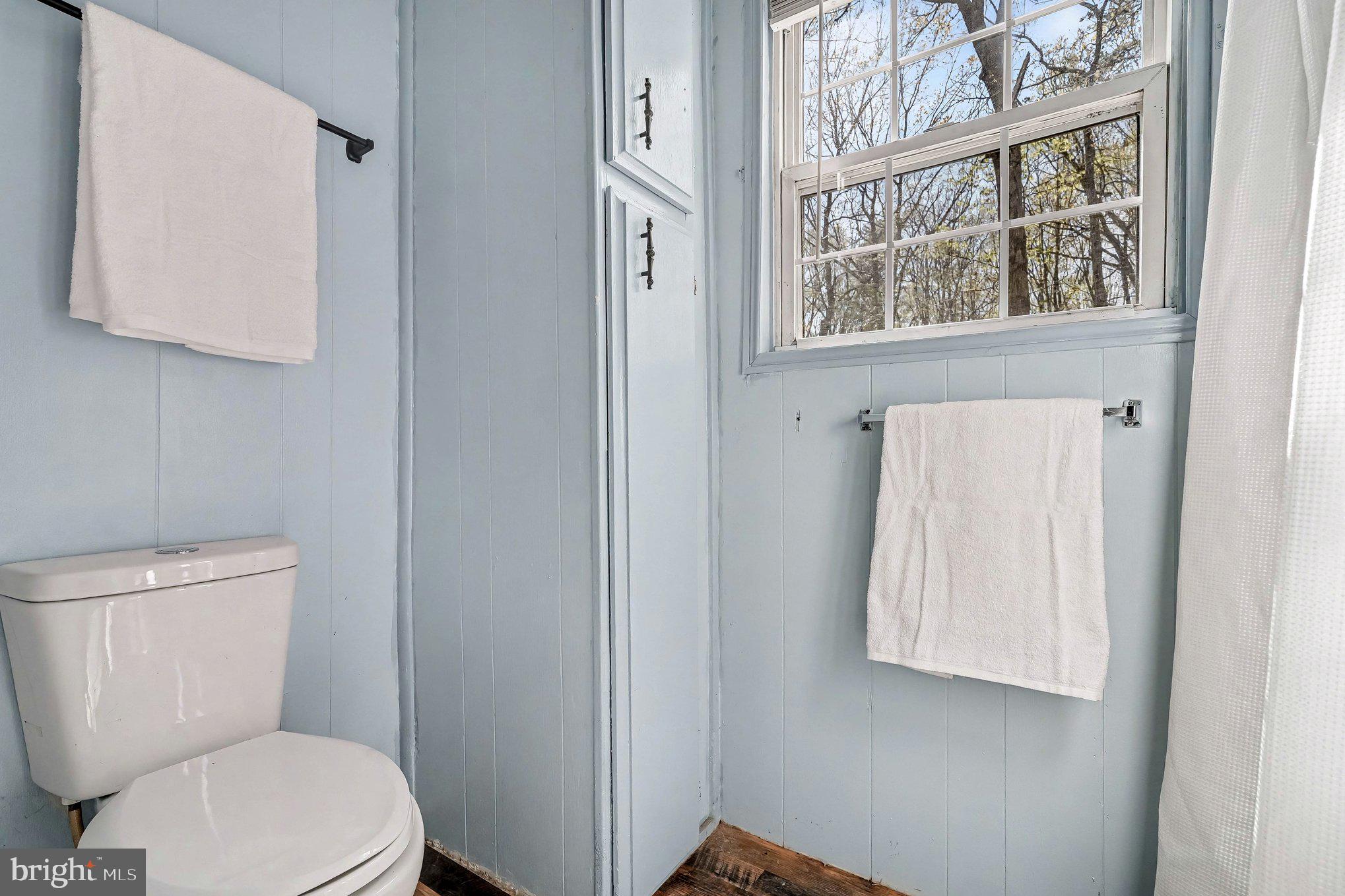 3440 Van Buren Road Burr Hill, VA 22433 - Photo 14 of 24 a white toilet sitting next to a bathroom sink