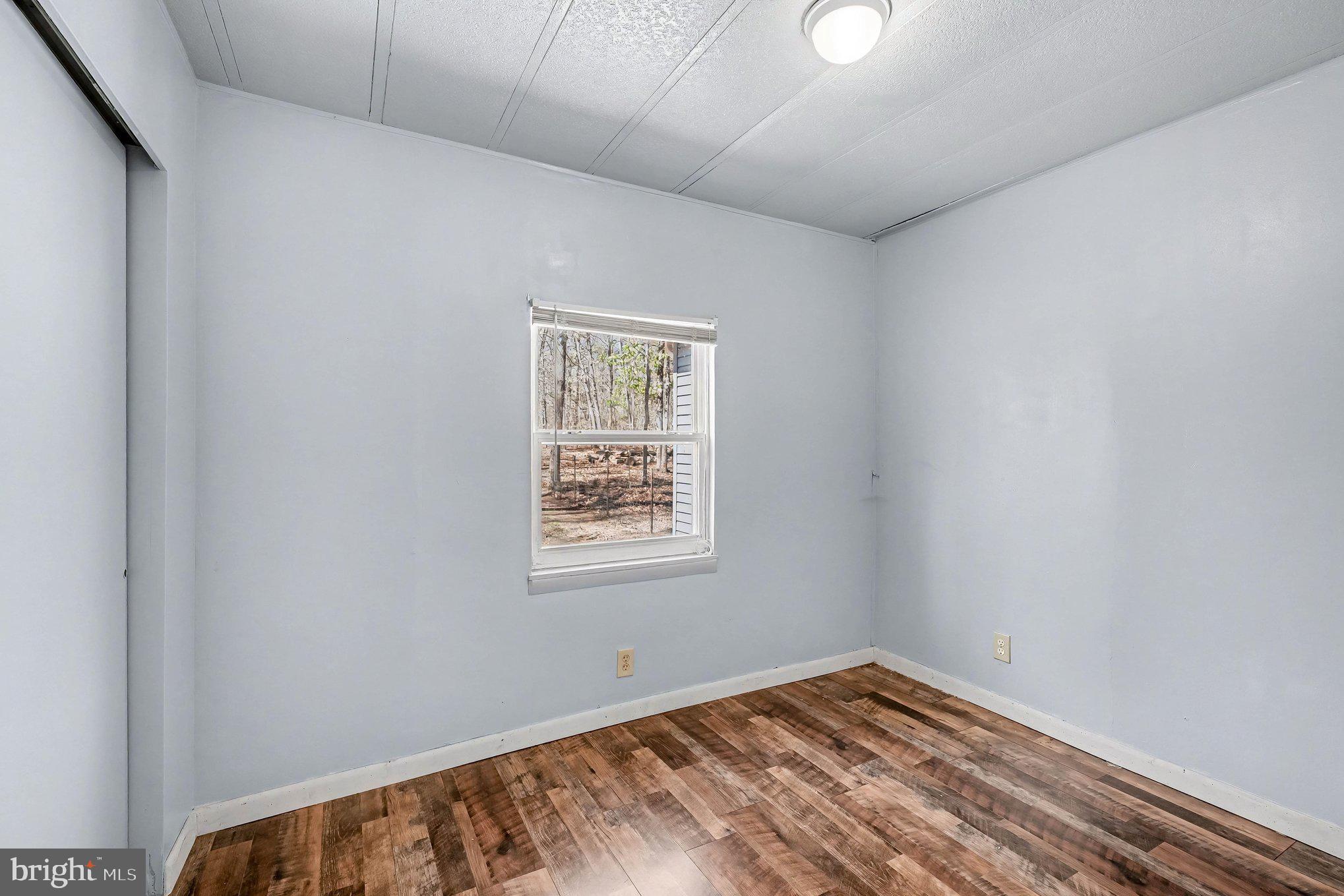 3440 Van Buren Road Burr Hill, VA 22433 - Photo 15 of 24 an empty room with windows