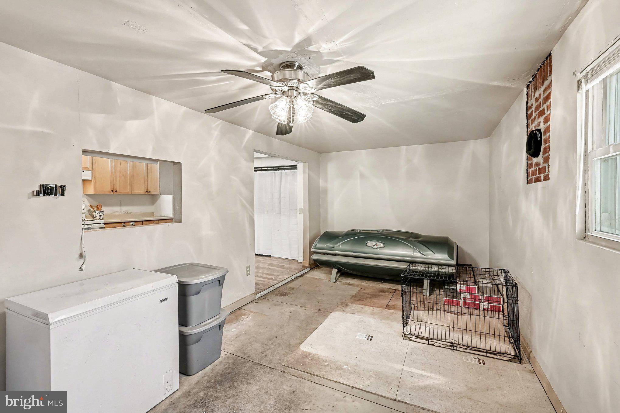 3440 Van Buren Road Burr Hill, VA 22433 - Photo 19 of 24 a bedroom with a bed and a chandelier