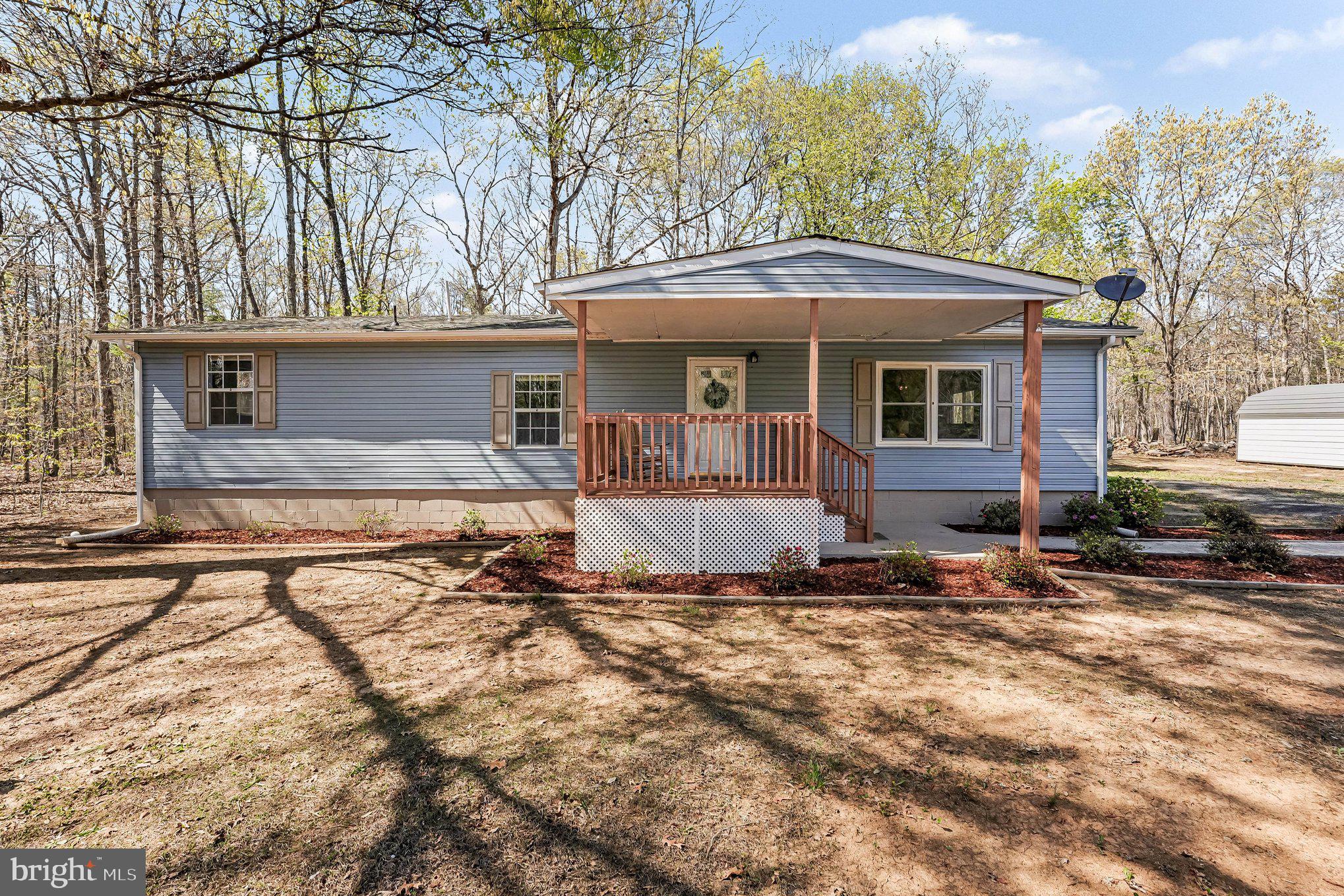 3440 Van Buren Road Burr Hill, VA 22433 - Photo 2 of 24 front view of a house with a yard