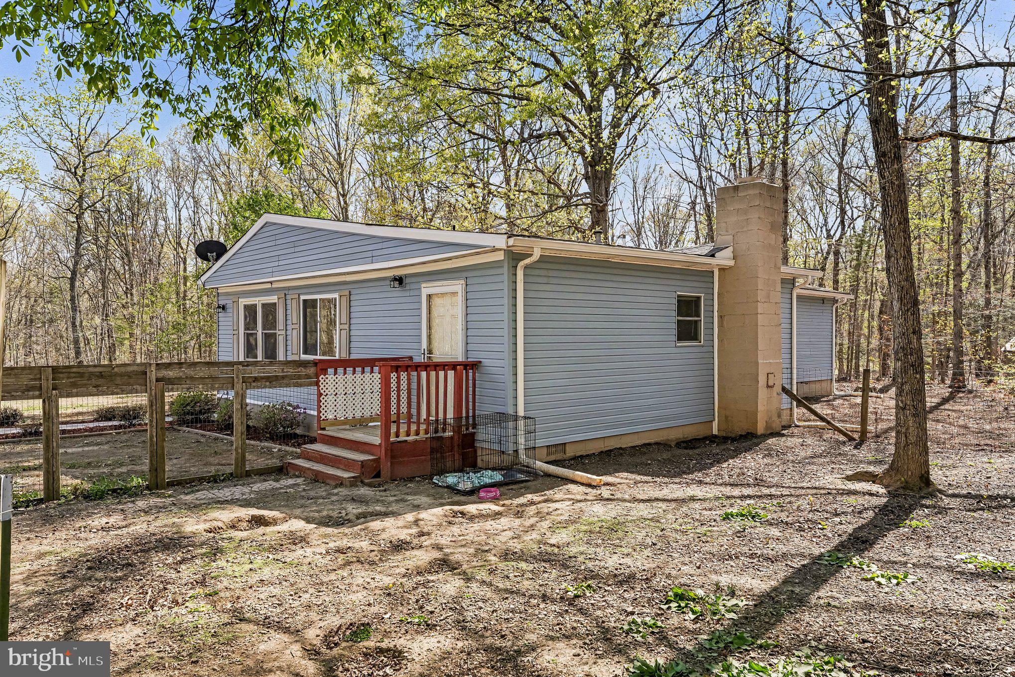 3440 Van Buren Road Burr Hill, VA 22433 - Photo 23 of 24 a view of a house with a yard and wooden fence