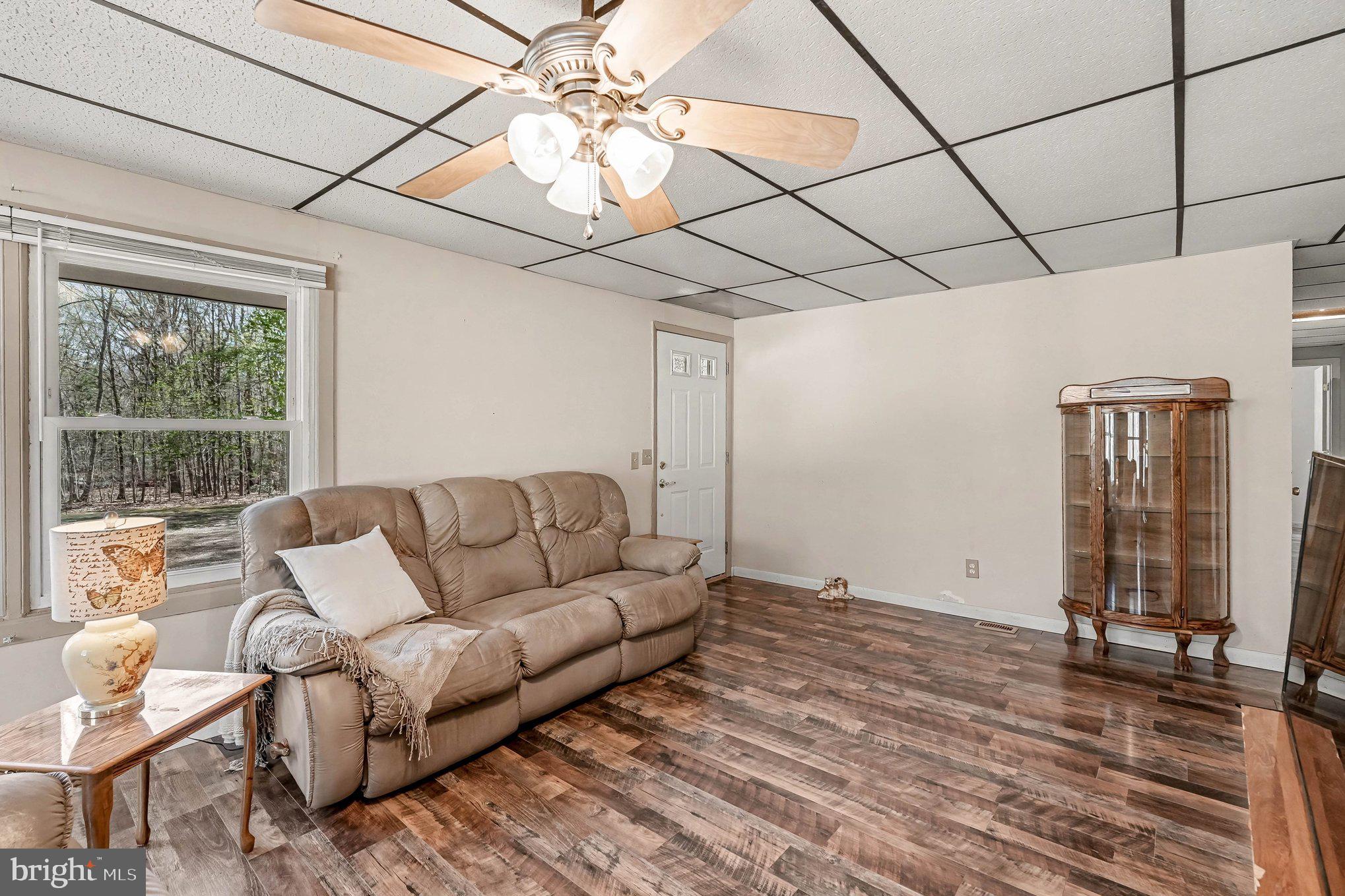 3440 Van Buren Road Burr Hill, VA 22433 - Photo 4 of 24 a living room with furniture and a chandelier