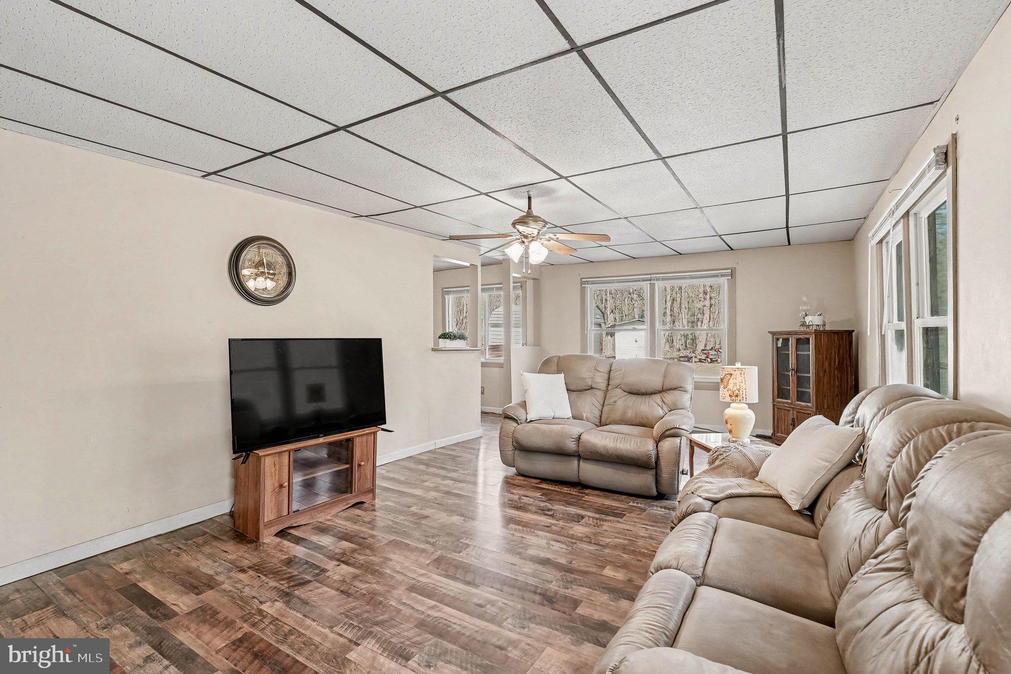 3440 Van Buren Road Burr Hill, VA 22433 - Photo 5 of 24 a living room with furniture and a flat screen tv