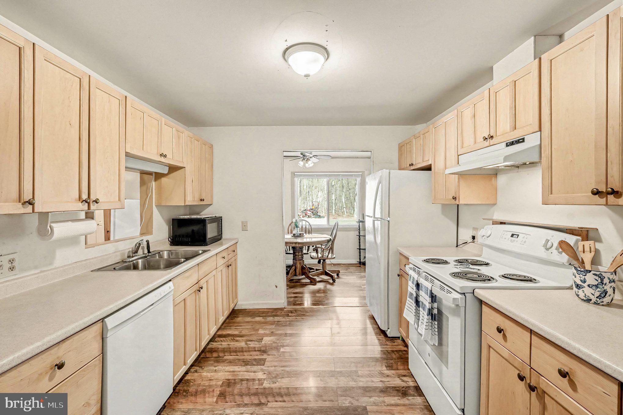 3440 Van Buren Road Burr Hill, VA 22433 - Photo 7 of 24 a kitchen with stainless steel appliances a sink stove and cabinets