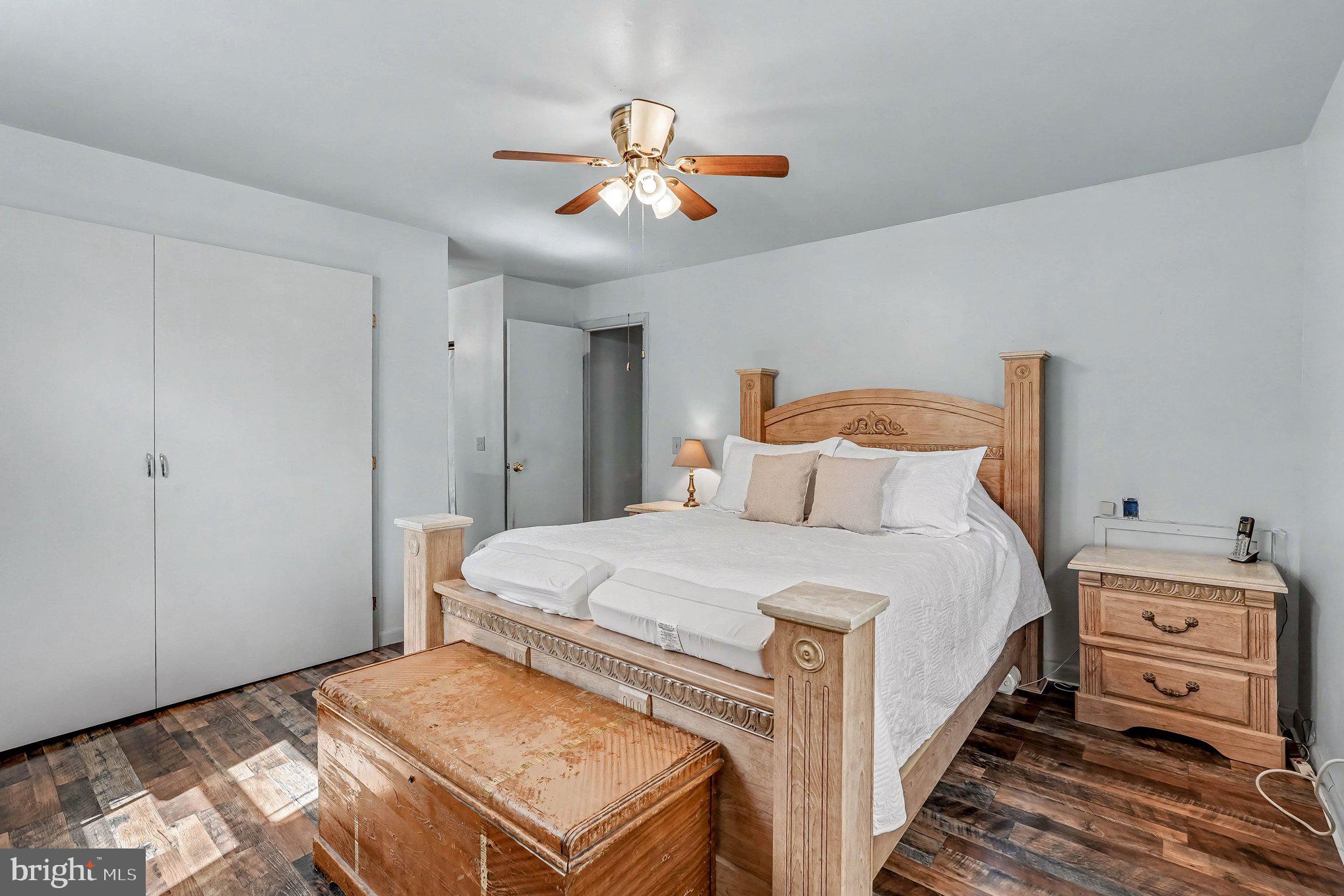 3440 Van Buren Road Burr Hill, VA 22433 - Photo 10 of 24 a bedroom with a bed and a chandelier