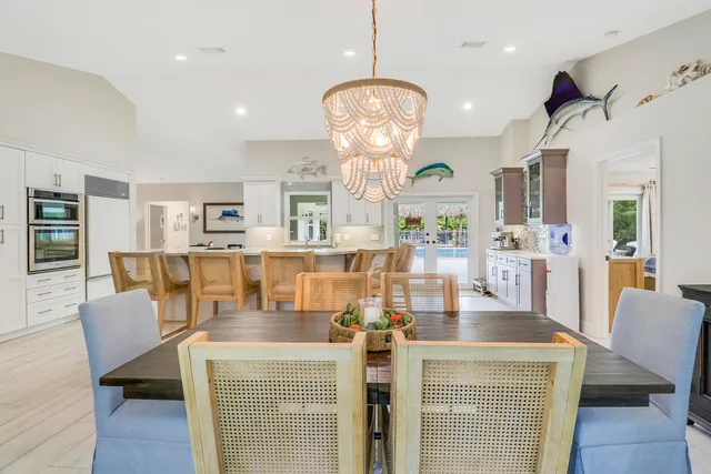 a kitchen with stainless steel appliances granite countertop a sink and a refrigerator