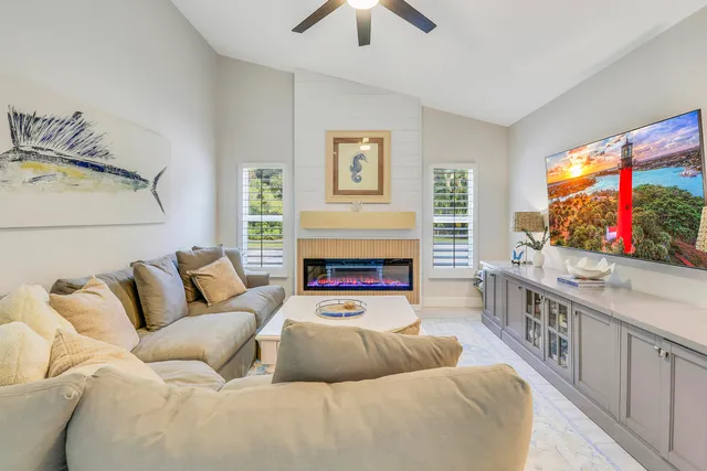 a living room with furniture and white walls