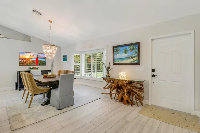 a view of a dining room with furniture window and outside view