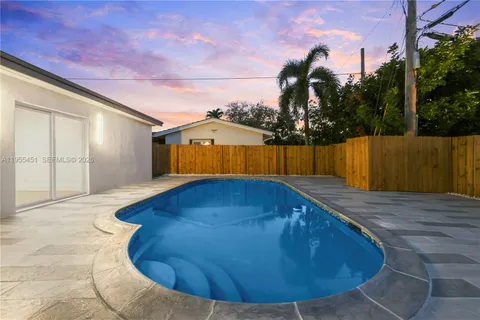 a view of outdoor space with swimming pool and valleys in the background