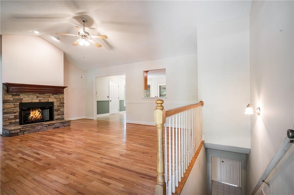 90 Chimney Sweep Trail Fairmount, GA 30139 - Photo 19 of 42 a view of a livingroom with wooden floor and a fireplace
